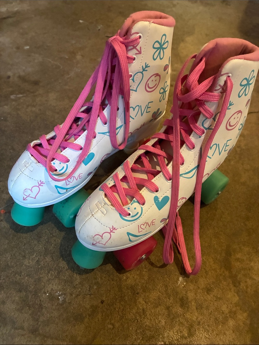 White and Pink Youth Roller Skates with Teal Wheels